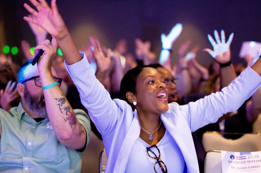 Shanda Martin cheering in an audience.